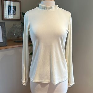 Ribbed top with ruffle neckline